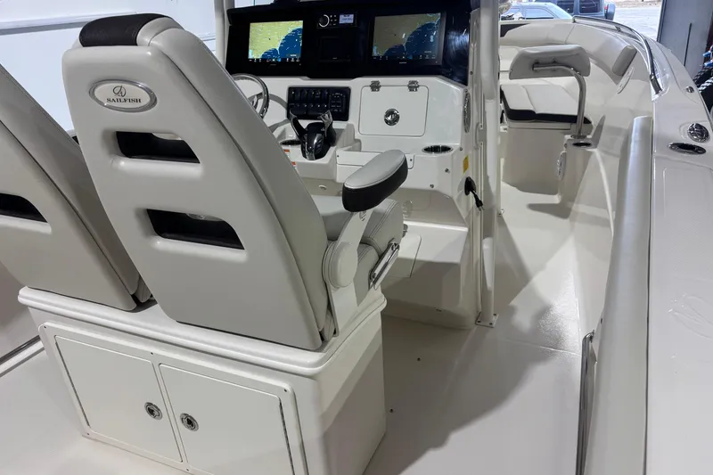 Slide: The Image of 2024 Sailfish 242 CC boat interior with modern dashboard and seating. - 16