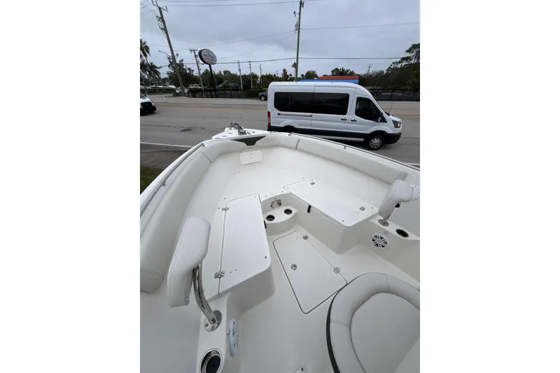 Slide: The Image of 2024 Sailfish 242 CC boat interior with seating and storage compartments. - 3