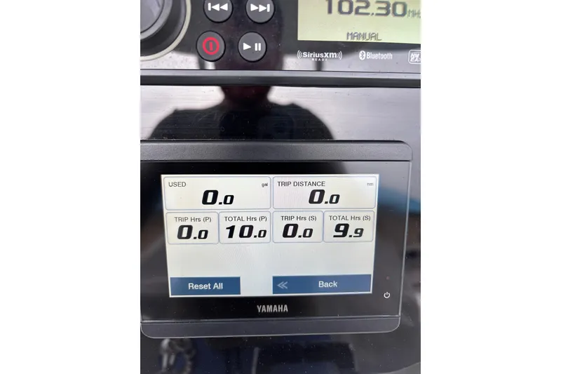 Slide: The Image of Yamaha display on 2024 Sailfish 242 CC showing trip and fuel data. - 4