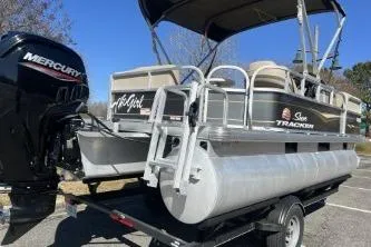 Slide: The Image of 2021 Sun Tracker Party Barge 18 DLX pontoon boat with Mercury engine on trailer. - 4