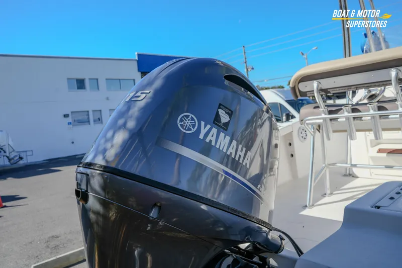 Slide: The Image of 2019 Tidewater 198 CC Adventure with Yamaha outboard motor in a boat dealership. - 19