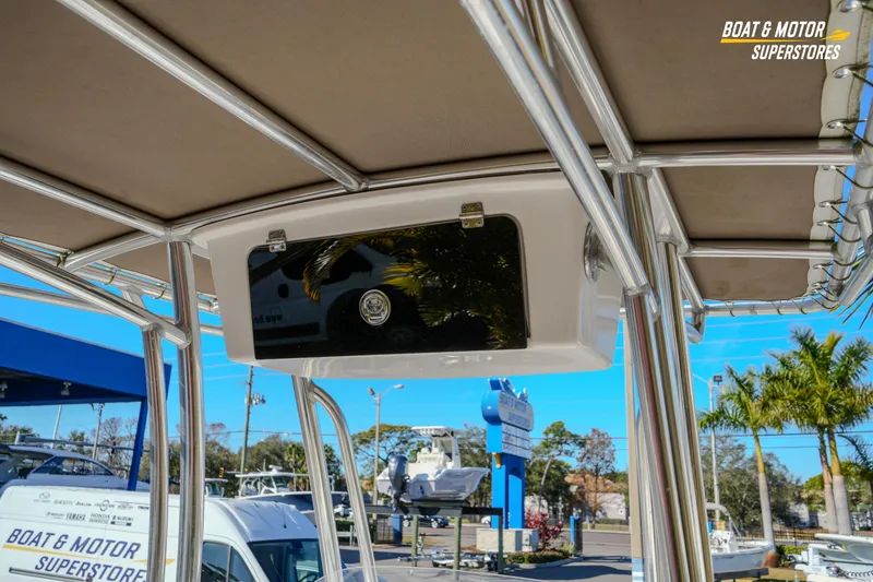 Slide: The Image of 2019 Tidewater 198 CC Adventure boat with T-top and storage compartment at dealership. - 29