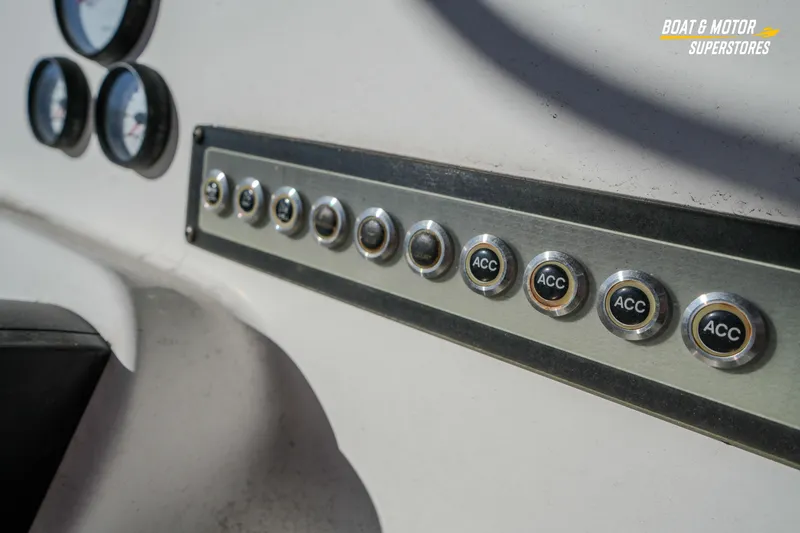 Slide: The Image of Dashboard of 2019 Tidewater 198 CC Adventure boat with accessory switches and gauges. - 30