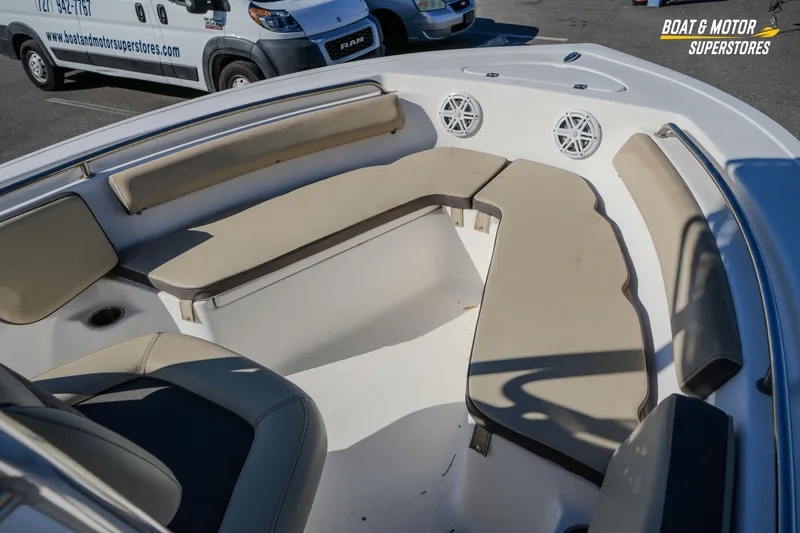Slide: The Image of 2019 Tidewater 198 CC Adventure boat interior with cushioned seating and speakers. - 33