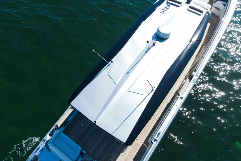 Slide: The Image of 2024 Nor-Tech 500 Sport Center Console on water, aerial view, sleek design. - 13