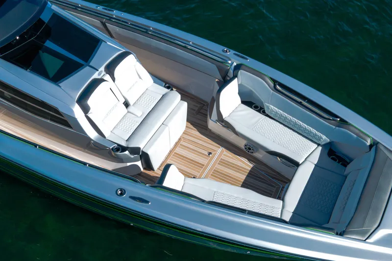 Slide: The Image of 2024 Nor-Tech 500 Sport Center Console with luxurious seating and sleek design on water. - 15