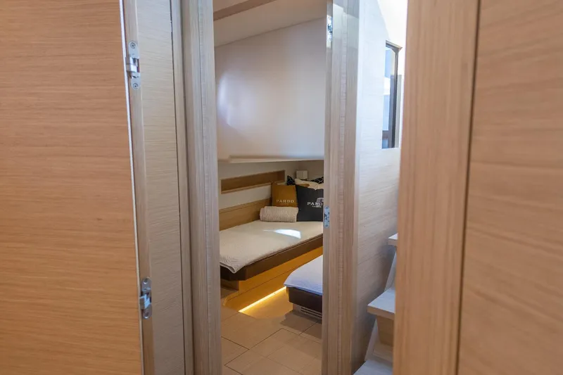 Slide: The Image of Interior cabin view of 2019 Pardo Yachts P50, featuring cozy bedding and modern design. - 23