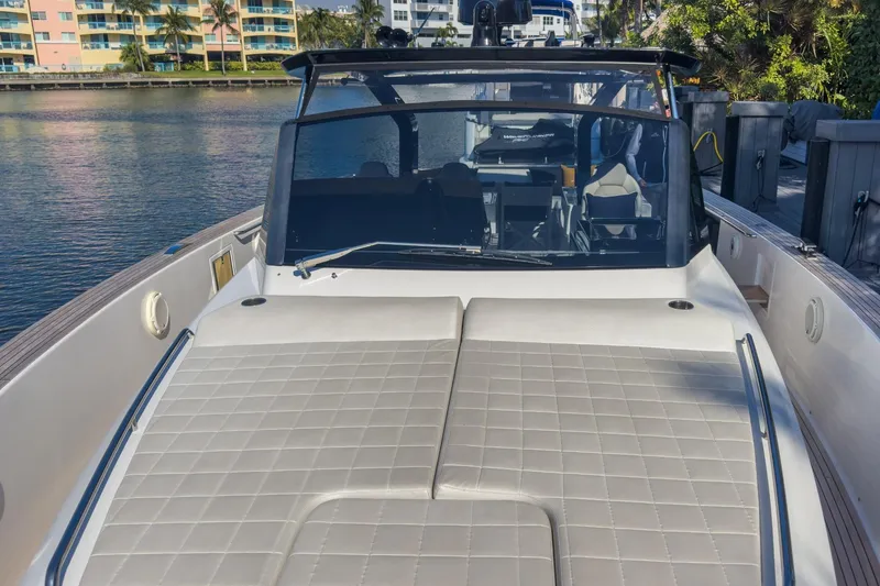 Slide: The Image of 2019 Pardo Yachts P50 luxury yacht docked by waterfront buildings. - 29