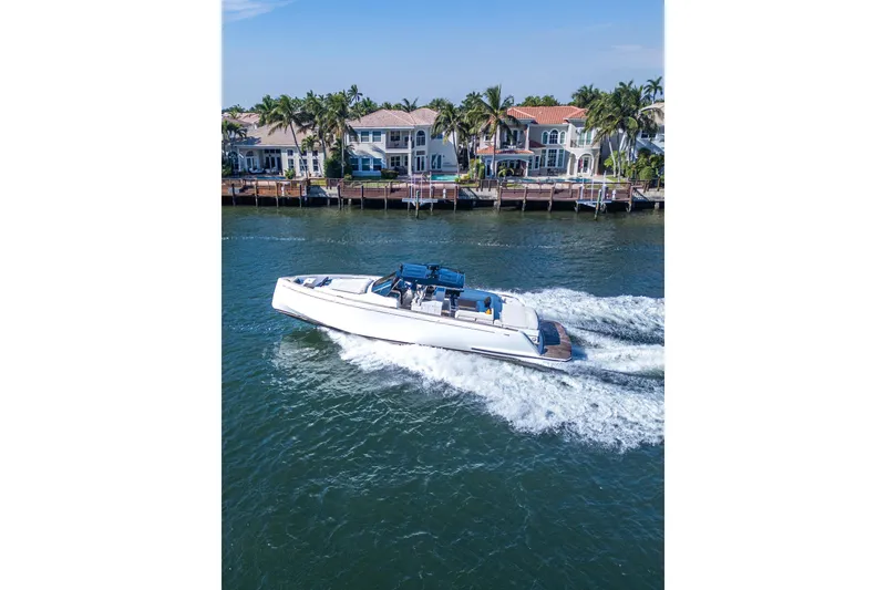 Slide: The Image of 2019 Pardo Yachts P50 cruising near waterfront homes on a sunny day. - 31