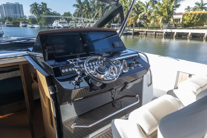 Slide: The Image of Helm of 2019 Pardo Yachts P50, featuring modern controls and luxurious seating. - 17