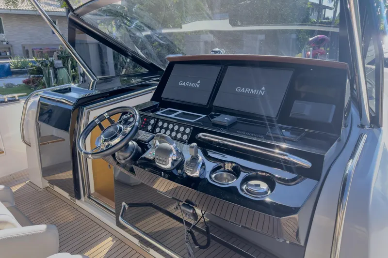 Slide: The Image of Helm of 2019 Pardo Yachts P50 with Garmin navigation displays and sleek controls. - 18