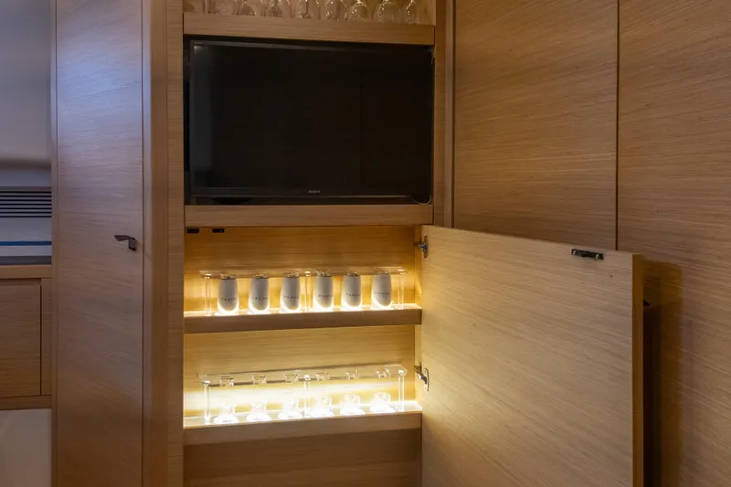 Slide: The Image of Luxurious interior of 2019 Pardo Yachts P50 with illuminated glass cabinet. - 24