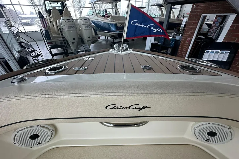 Slide: The Image of 2024 Chris-Craft Catalina 24 boat interior with branded flag and elegant design. - 12