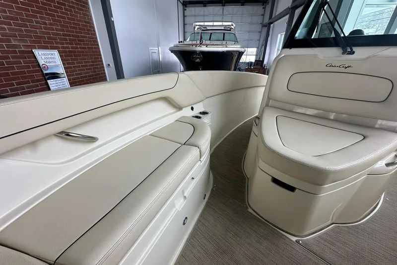 Slide: The Image of 2024 Chris-Craft Catalina 24 interior with beige seating and sleek design. - 15