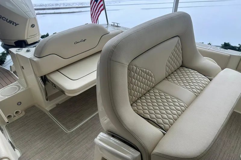 Slide: The Image of 2024 Chris-Craft Catalina 24 boat interior with luxurious seating and Mercury engine. - 19