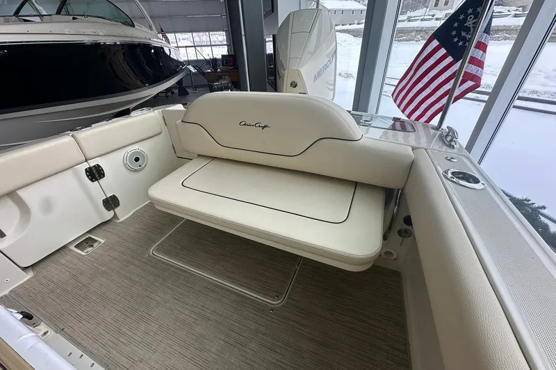 Slide: The Image of 2024 Chris-Craft Catalina 24 boat interior with seating and American flag. - 20