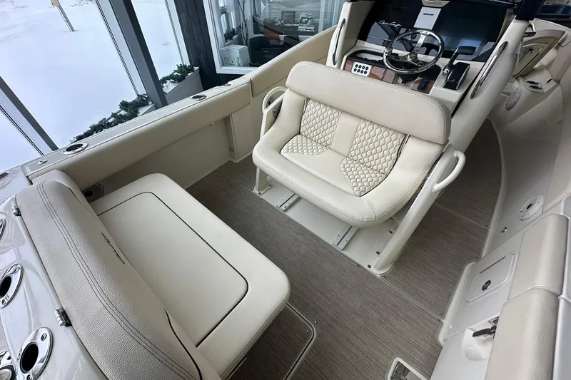 Slide: The Image of 2024 Chris-Craft Catalina 24 interior with luxurious seating and modern helm design. - 22