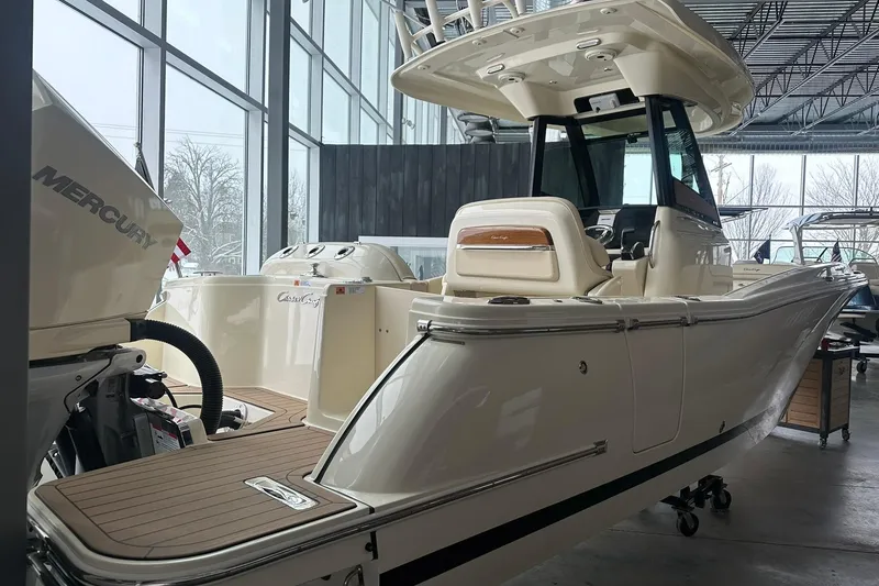 Slide: The Image of 2024 Chris-Craft Catalina 24 boat in showroom, featuring Mercury engine. - 3