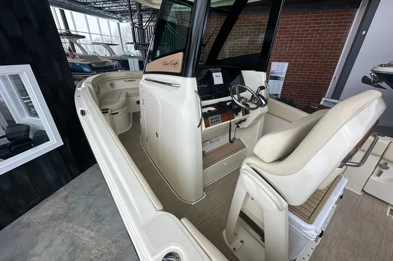 Slide: The Image of 2024 Chris-Craft Catalina 24 boat interior with helm and seating area. - 5