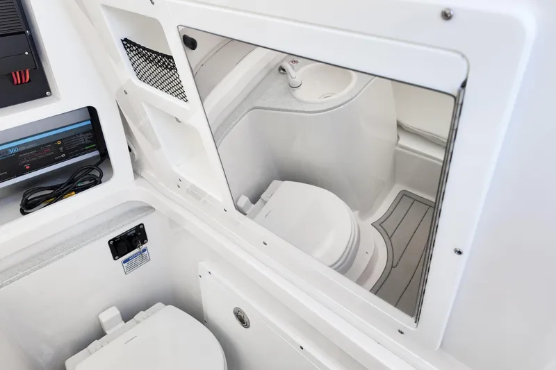 Slide: The Image of 2026 Sea Fox 328 Commander boat interior with mirror and compact bathroom amenities. - 19