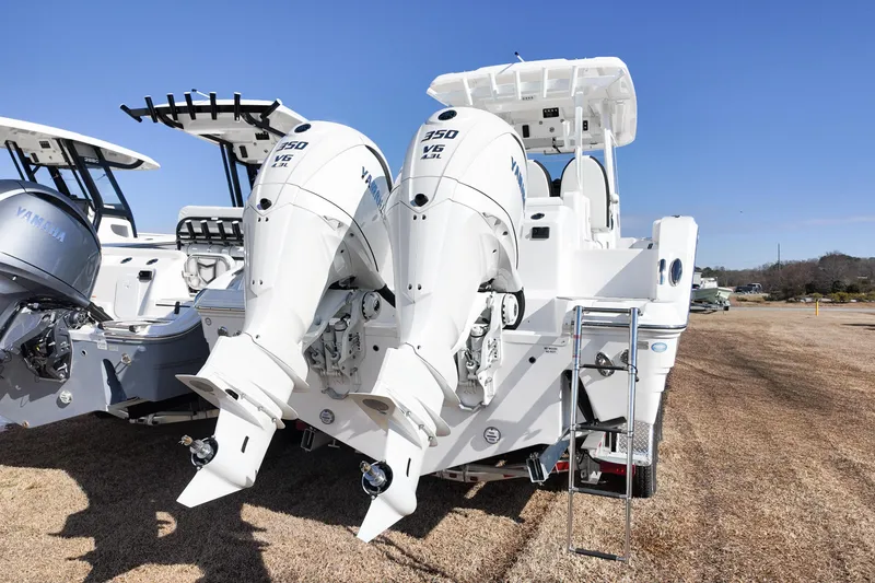 Slide: The Image of 2026 Sea Fox 328 Commander with twin Yamaha 350 V8 engines, rear view. - 2