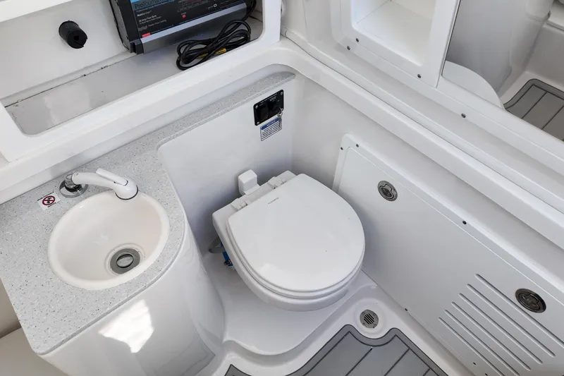 Slide: The Image of 2026 Sea Fox 328 Commander boat bathroom with sink and toilet. - 20
