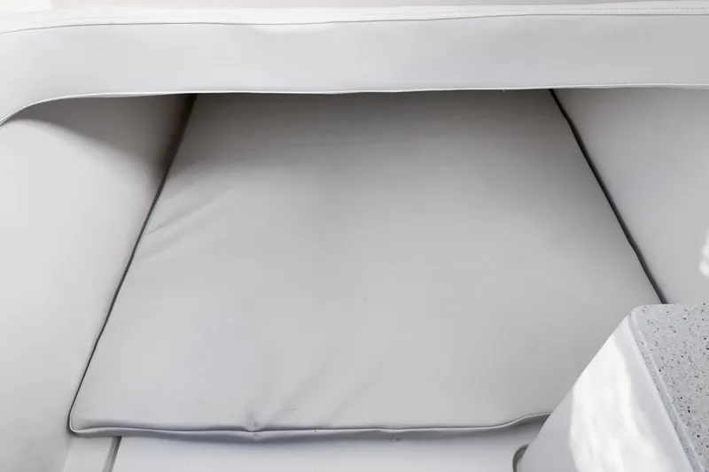 Slide: The Image of Interior seating of 2026 Sea Fox 328 Commander boat, featuring white cushioned upholstery. - 22