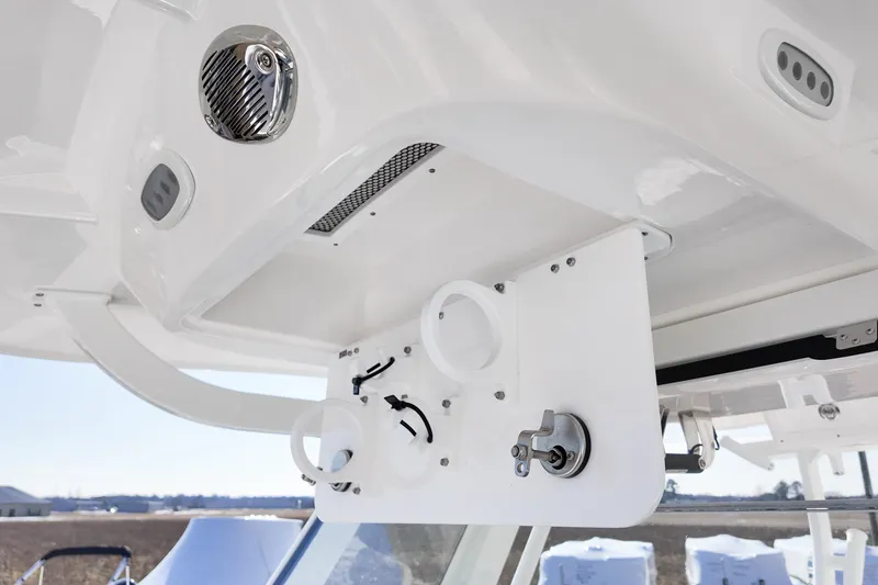 Slide: The Image of 2026 Sea Fox 328 Commander boat interior, featuring rod holders and speaker system. - 24
