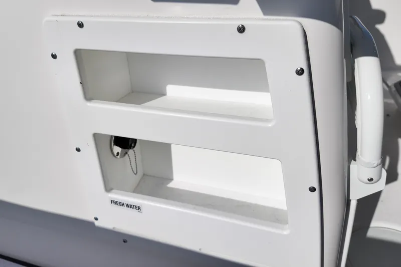 Slide: The Image of Freshwater compartment on 2026 Sea Fox 328 Commander boat, featuring sleek white design. - 26