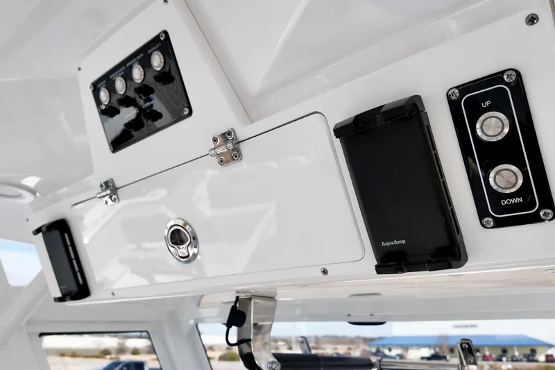 Slide: The Image of Control panel of 2026 Sea Fox 328 Commander boat with switches and buttons. - 28
