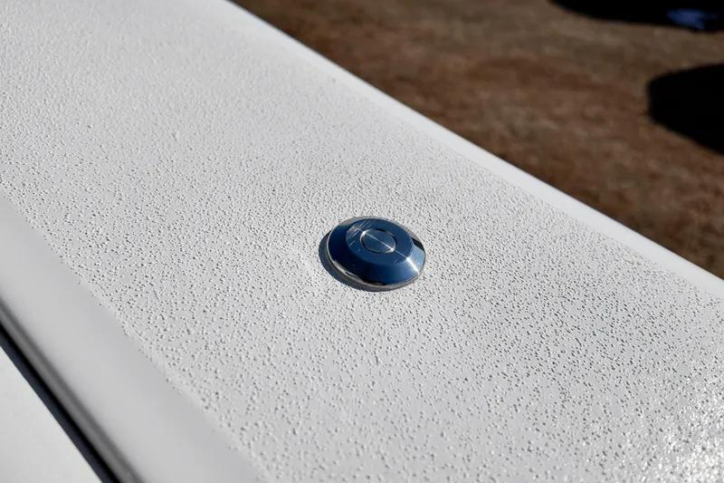 Slide: The Image of Close-up of 2026 Sea Fox 328 Commander textured surface with a metallic button. - 33