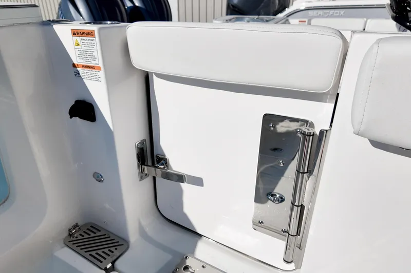 Slide: The Image of 2026 Sea Fox 328 Commander boat interior with safety warning and stainless steel hardware. - 34