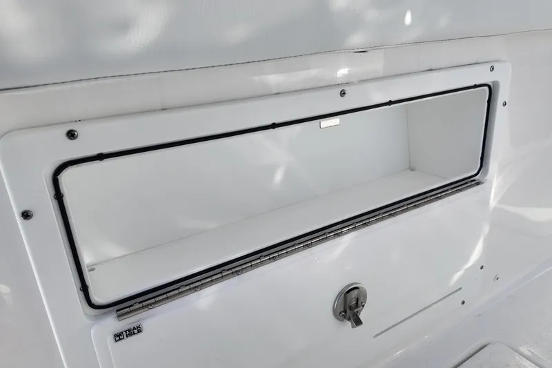 Slide: The Image of Storage compartment on 2026 Sea Fox 328 Commander boat, featuring a secure latch and sleek design. - 36