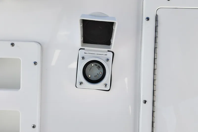 Slide: The Image of 2026 Sea Fox 328 Commander boat power outlet with protective cover. - 39