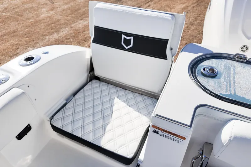 Slide: The Image of 2026 Sea Fox 328 Commander boat seat and livewell detail, featuring sleek design. - 4