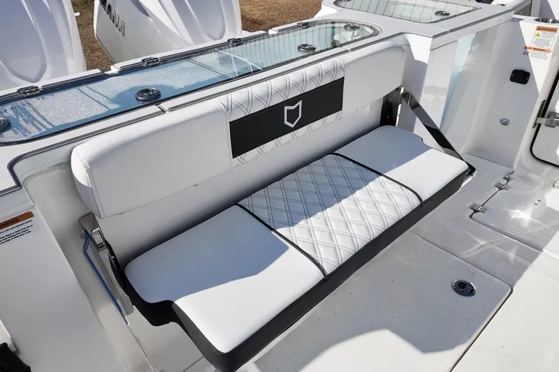 Slide: The Image of 2026 Sea Fox 328 Commander boat with white cushioned seating and sleek design. - 44