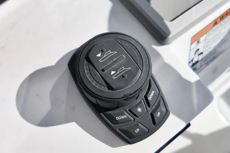 Slide: The Image of Control panel on 2026 Sea Fox 328 Commander boat, featuring directional buttons. - 45