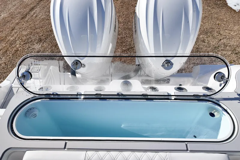 Slide: The Image of 2026 Sea Fox 328 Commander livewell with open lid, showcasing sleek design and functionality. - 46