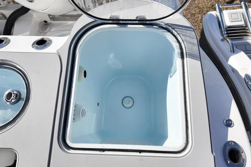 Slide: The Image of Livewell on 2026 Sea Fox 328 Commander boat, open lid, white interior. - 47