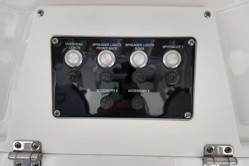 Slide: The Image of Control panel of 2026 Sea Fox 328 Commander boat with labeled switches. - 48