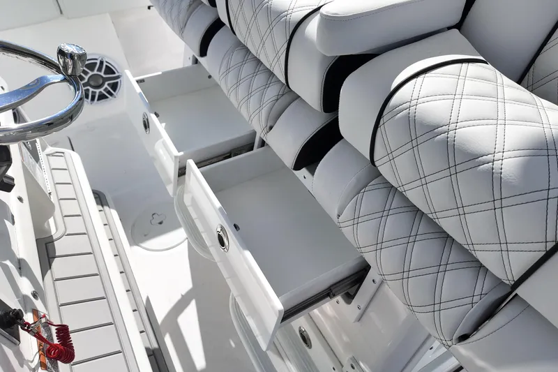 Slide: The Image of 2026 Sea Fox 328 Commander boat interior with luxurious seating and storage drawers. - 50