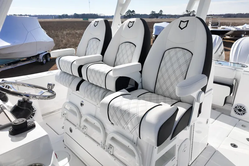 Slide: The Image of Luxurious seating on 2026 Sea Fox 328 Commander boat, featuring elegant white and black design. - 53