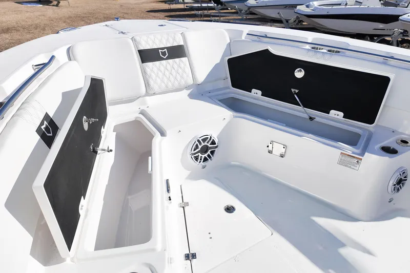 Slide: The Image of 2026 Sea Fox 328 Commander boat interior with open storage compartments and seating. - 55