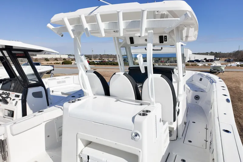 Slide: The Image of 2026 Sea Fox 328 Commander boat interior with dual seats and control panel. - 56