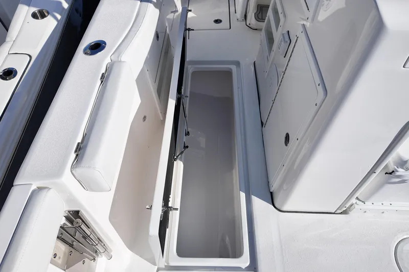 Slide: The Image of 2026 Sea Fox 328 Commander boat interior with open storage compartment. - 7