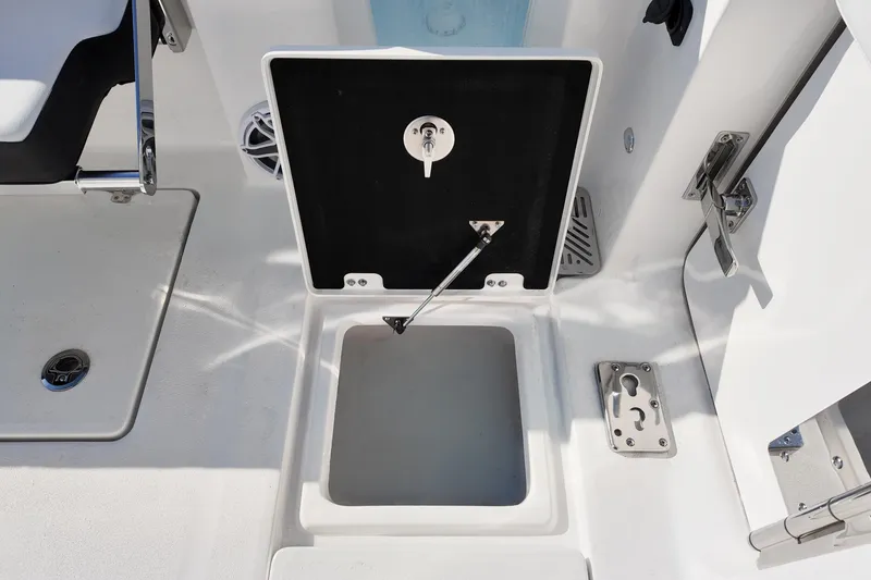 Slide: The Image of 2026 Sea Fox 328 Commander boat storage compartment with open hatch and stainless steel hardware. - 8