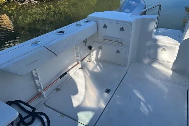 Slide: The Image of 2008 Glacier Bay 2670 Cuddy boat interior with storage compartments and seating. - 18