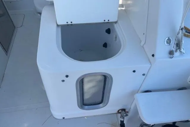 Slide: The Image of 2008 Glacier Bay 2670 Cuddy boat interior with storage compartment. - 20