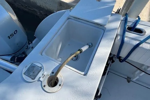 Slide: The Image of 2008 Glacier Bay 2670 Cuddy boat with sink and hose on deck. - 22