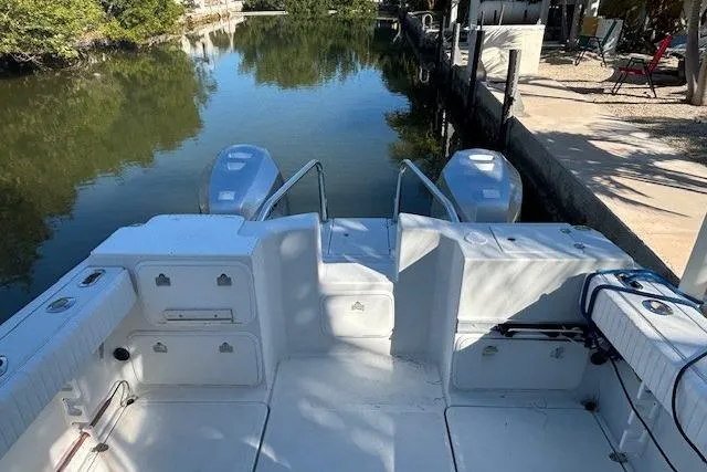 Slide: The Image of 2008 Glacier Bay 2670 Cuddy boat docked by a serene waterway. - 23
